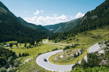 Swiss mountain road with traffic signs